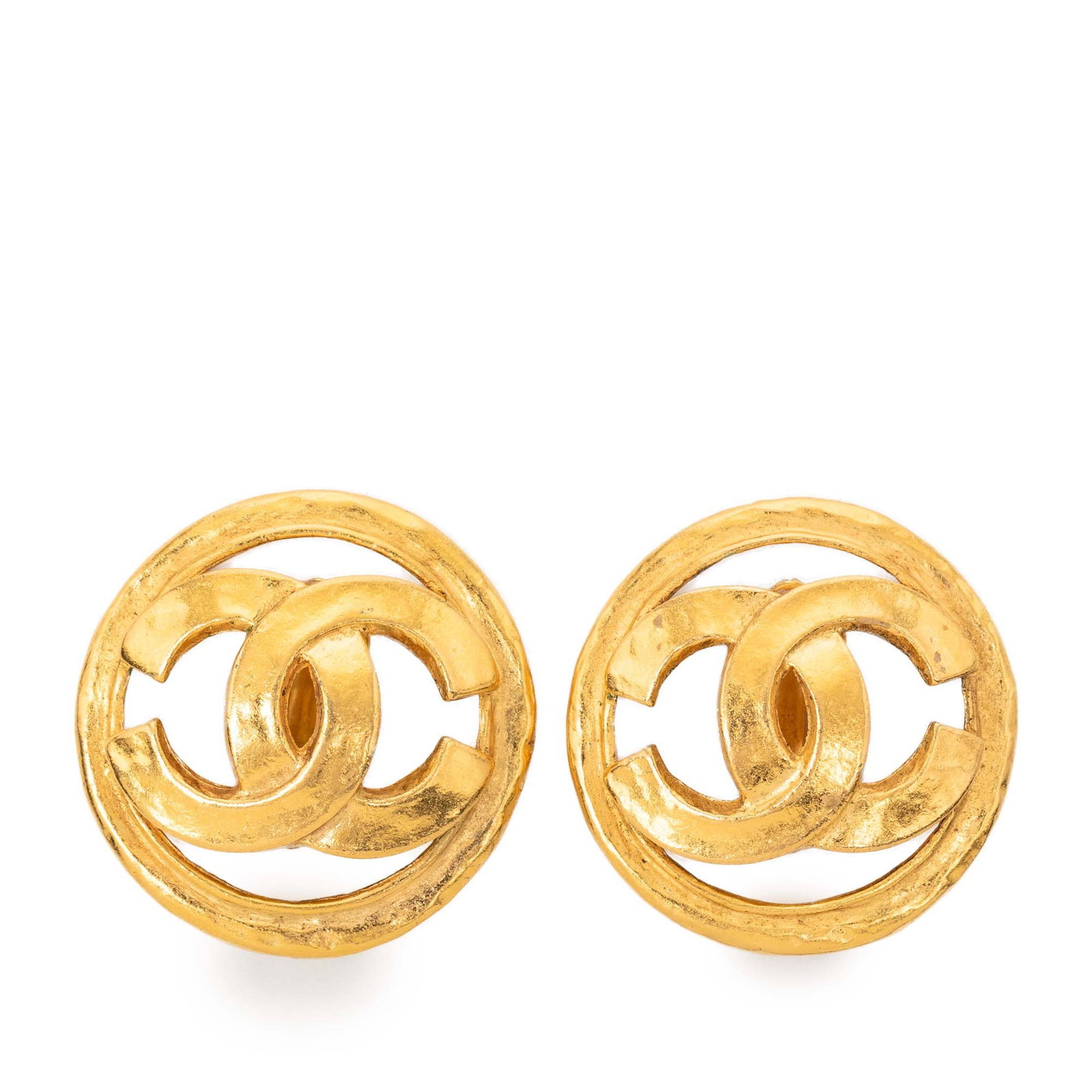 Chanel Gold Tone Metal CC Logo Round Clip Earrings: Chanel Gold Tone Metal CC Logo Round Clip Earrings These Chanel clip-on earrings feature a round design crafted from gold-tone metal and display the iconic CC motif. Made in France, these earrings are
