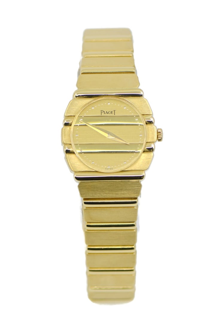 Piaget Polo Reference 861C701 Ladies Wristwatch in 18K Yellow Gold: Piaget Polo Reference 861C701 Ladies Wristwatch in 18K Yellow Gold This Piaget Polo wristwatch features a luxurious 18K yellow gold case, bracelet, and smooth bezel, complemented by a gold-tone dial a