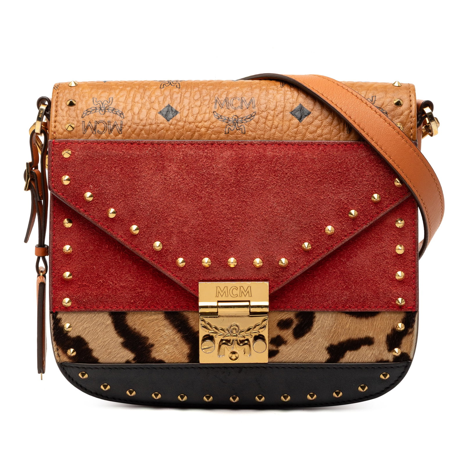 MCM Patricia Crossbody in Suede and Pony Hair with Stud Embellishments: MCM Patricia Crossbody in Suede and Pony Hair with Stud Embellishments This MCM Patricia crossbody bag showcases a combination of suede leather and pony hair, accented with stud embellishments. It fea