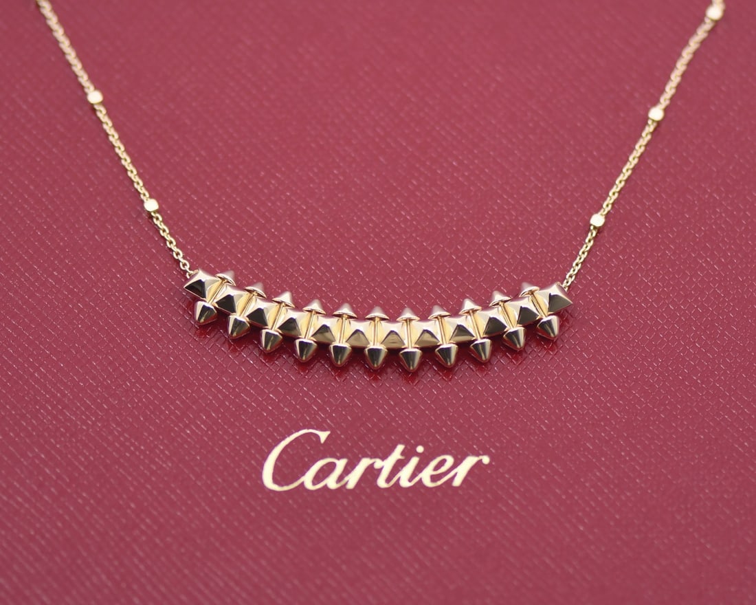 Cartier 18k Rose Gold Medium Clash Pendant Necklace 16 Inch With Certificate: Cartier 18k Rose Gold Medium Clash Pendant Necklace 16 Inch With Certificate This Cartier Clash necklace is crafted from 18K rose gold and features a pendant design from the Medium Model collection. T