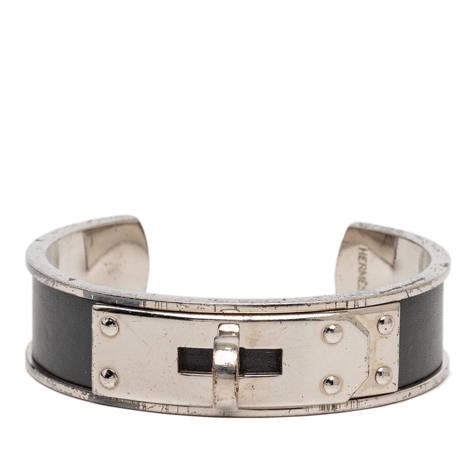 Hermes Kelly cuff bracelet leather palladium plated black: Hermes Kelly cuff bracelet leather palladium plated black This Hermes bracelet features a black leather band complemented by palladium-plated accents, designed in the signature Kelly cuff style. Craft
