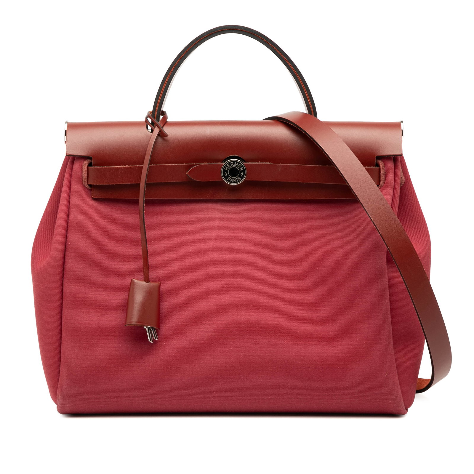 Hermes Toile Herbag Zip Retourne Verso 31 Red Canvas Bag: Hermes Toile Herbag Zip Retourne Verso 31 Red Canvas Bag The Hermes Toile Herbag Zip Retourne Verso 31 is a stylish and functional handbag crafted from durable canvas with leather trim. It features a 