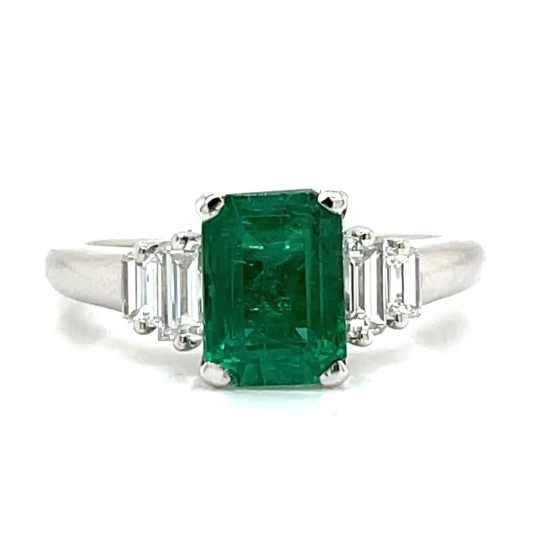 Platinum 1.76 Ct Emerald and 4 Diamond Ring: Platinum 1.76 Ct Emerald and 4 Diamond Ring This stunning Platinum ring showcases a vibrant 1.76 Ct. Emerald at its center, elegantly surrounded by four sparkling diamonds totaling approximately 0.50 