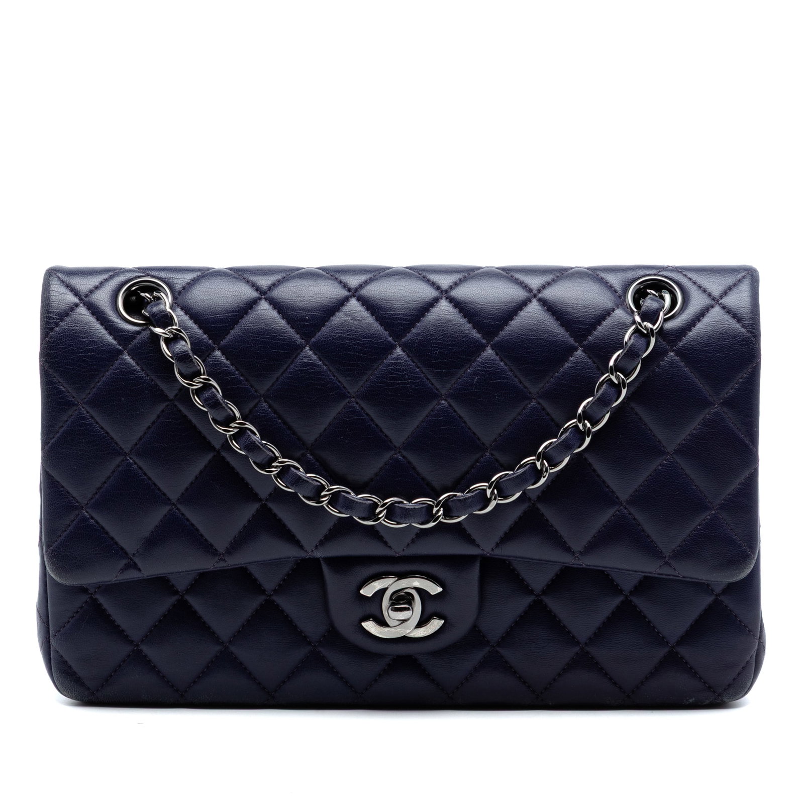 Chanel Purple Quilted Lambskin Double Flap Shoulder Bag: Chanel Purple Quilted Lambskin Double Flap Shoulder Bag This Chanel Medium Classic Lambskin Double Flap shoulder bag is crafted from quilted lambskin leather in a striking purple hue. It features leat