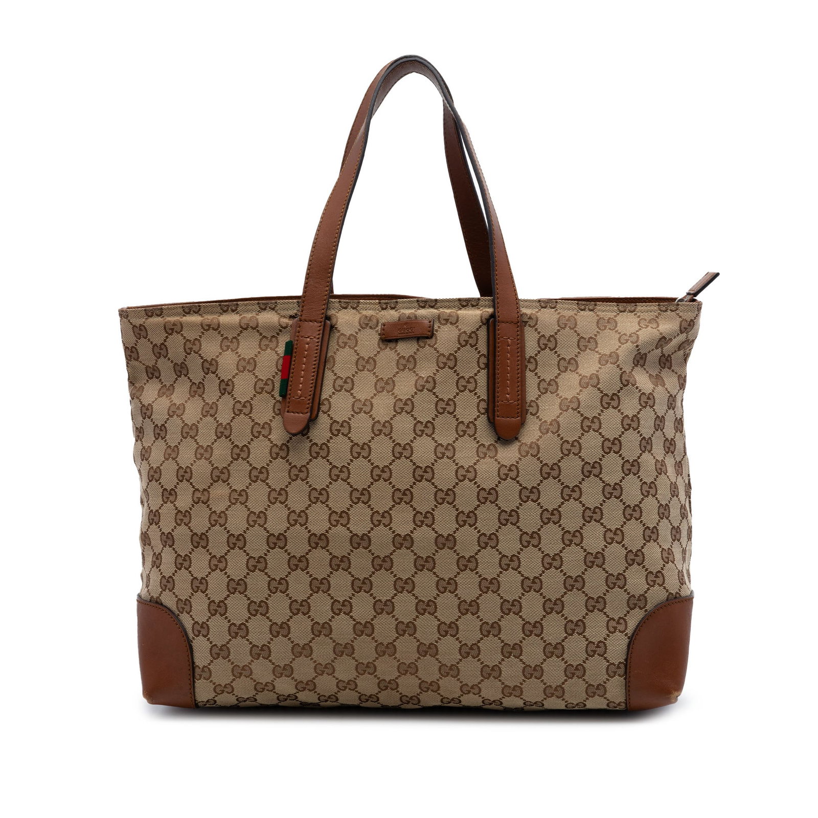 Gucci Beige Canvas Tote GG Web Leather Trim Zip Bag: Gucci Beige Canvas Tote GG Web Leather Trim Zip Bag This Gucci GG Canvas Web Tote is crafted in Italy and features a beige fabric body with leather trim. The tote is designed with flat leather straps,