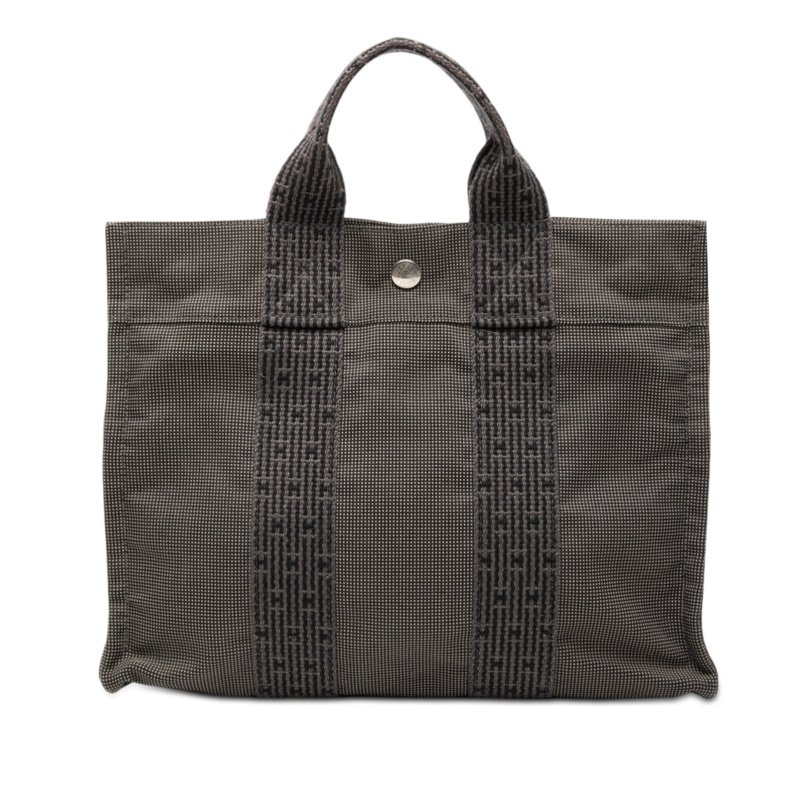 Hermes Herline PM gray canvas tote bag: Hermes Herline PM gray canvas tote bag The Hermes Herline PM is crafted from durable canvas and features flat straps, an open top with a snap closure, and an interior zip compartment. This gray fabric