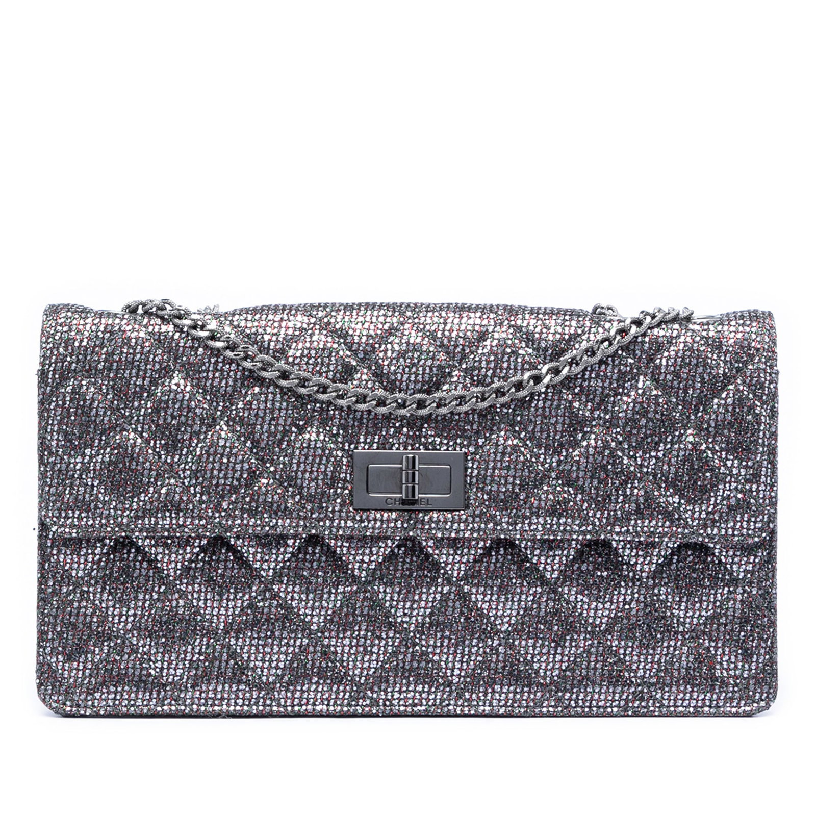 Chanel Reissue 2.55 Silver Glitter Canvas Quilted Flap Shoulder Bag: Chanel Reissue 2.55 Silver Glitter Canvas Quilted Flap Shoulder Bag This Chanel Quilted Glitter Canvas Reissue 2.55 Flap bag features a silver glittered canvas body, a chain link strap, and a front fl