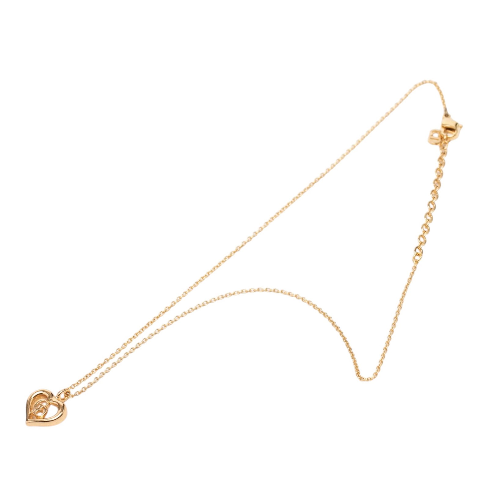 Dior Gold Plated Heart Pendant Necklace CD Logo: Dior Gold Plated Heart Pendant Necklace CD Logo This Dior necklace features a gold-tone metal heart pendant with the iconic CD logo, suspended from a matching gold-tone chain and secured with a lobste