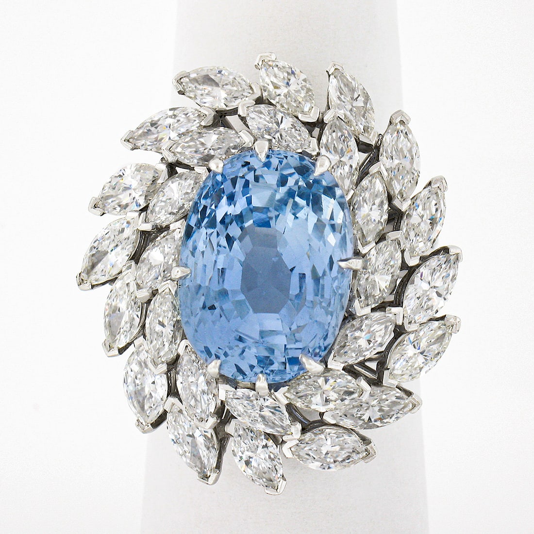GIA Certified Platinum Oval Ceylon Sapphire Diamond Halo Ring: GIA Certified Platinum Oval Ceylon Sapphire Diamond Halo Ring This handmade platinum ring features a GIA-certified, natural Ceylon sapphire from Sri Lanka as the centerpiece. The oval brilliant cut sa
