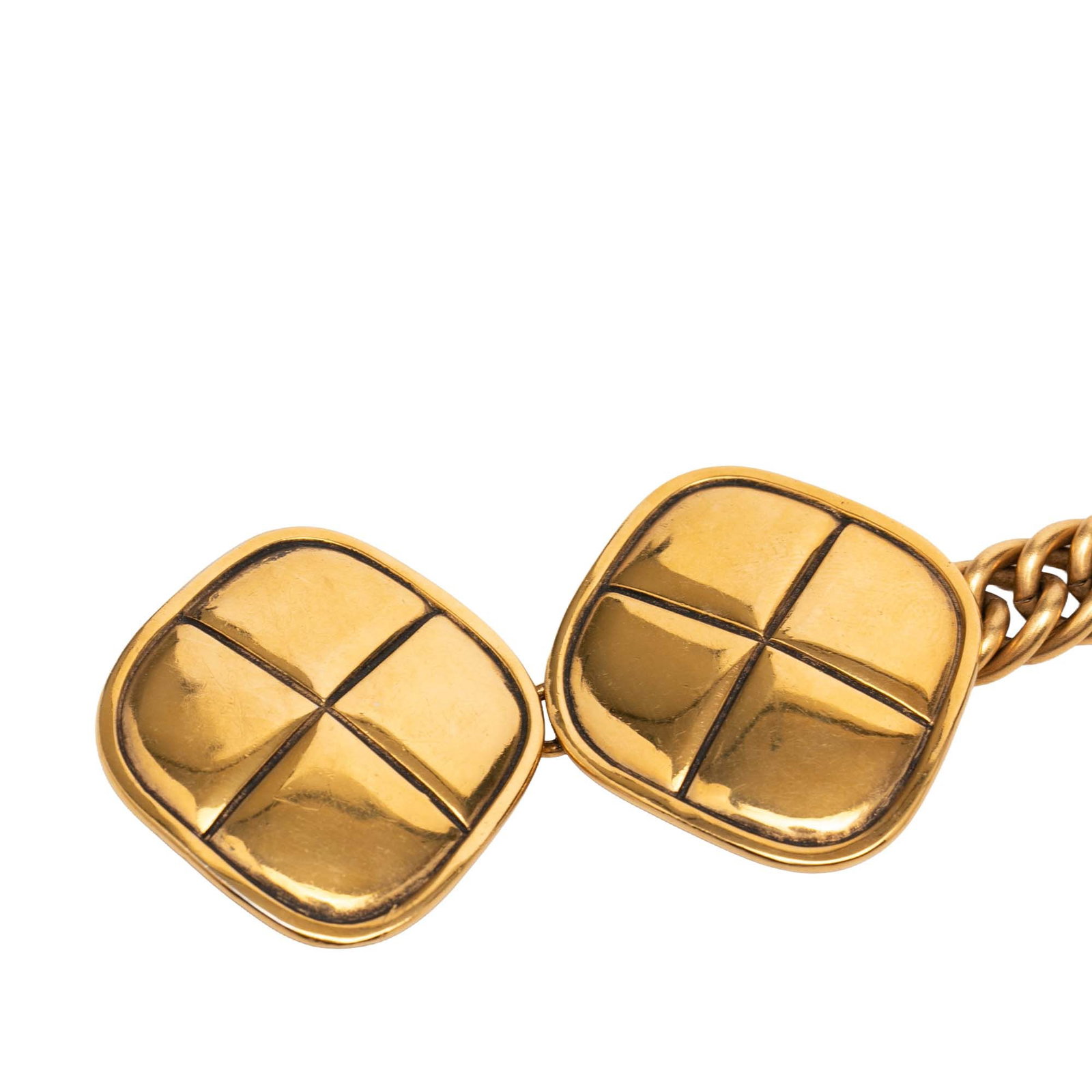 Chanel Gold Plated Metal Quilt Charm Belt: Chanel Gold Plated Metal Quilt Charm Belt This Chanel belt features a gold plated metal body with a quilt charm design and a hook closure. The accessory is crafted in France and comes in a gold color.