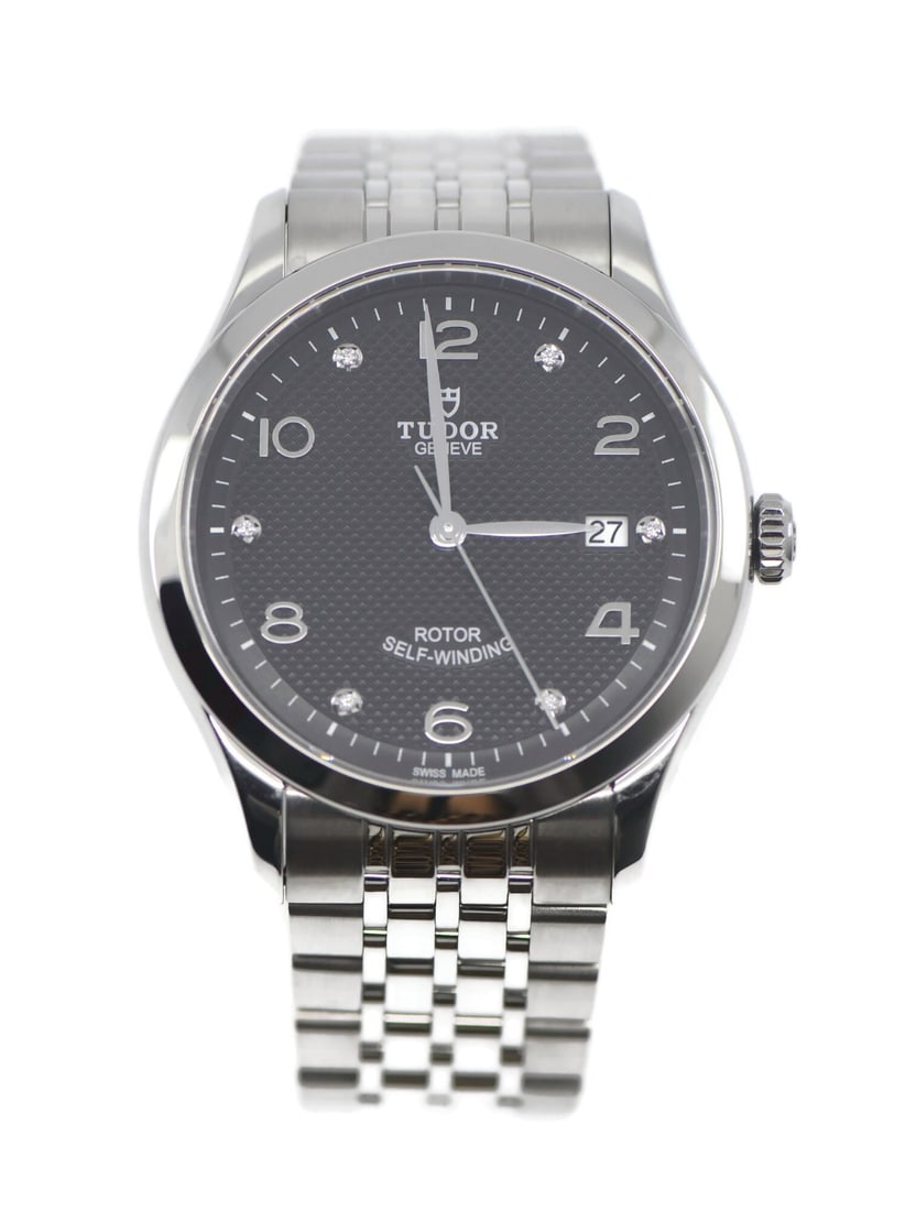 Tudor 1926 40mm Automatic Date Stainless Steel Men's Watch: Tudor 1926 40mm Automatic Date Stainless Steel Men's Watch This Tudor 1926 wristwatch features a stainless steel case and band, complemented by a smooth silver bezel and a polished finish. The round a