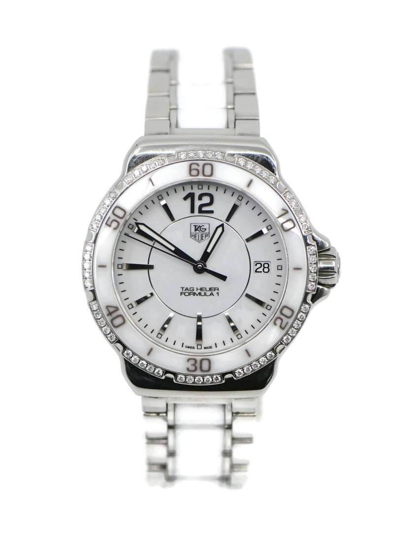 TAG Heuer Formula 1 WAH1213 Diamond Ceramic Steel Sport Watch with Box and Papers: TAG Heuer Formula 1 WAH1213 Diamond Ceramic Steel Sport Watch with Box and Papers This TAG Heuer Formula 1 wristwatch features a 34mm case crafted from ceramic and stainless steel, complemented by a m