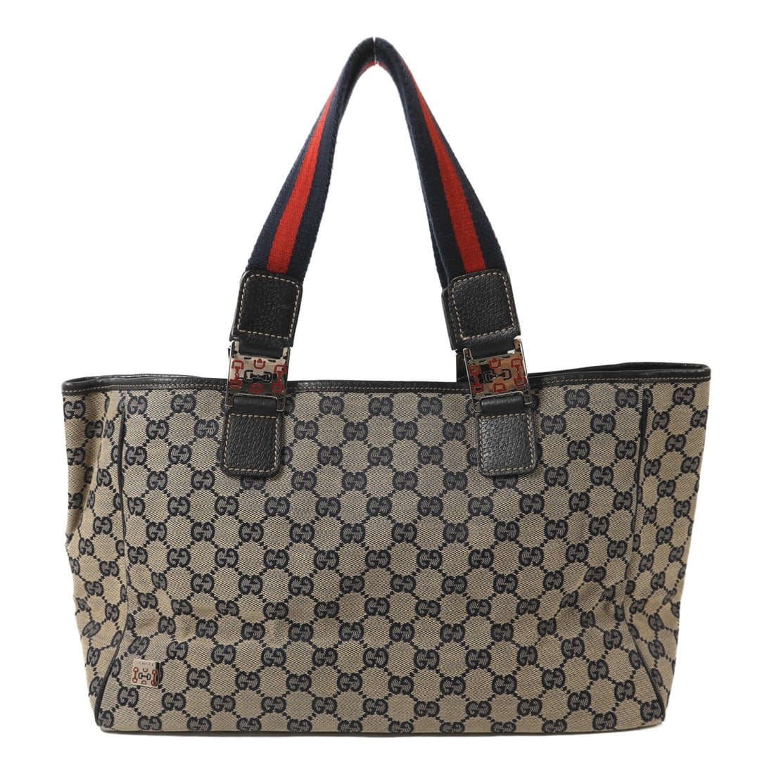 Gucci Medium GG Canvas Tote Navy and Brown Silver Hardware: Gucci Medium GG Canvas Tote Navy and Brown Silver Hardware This medium-sized Gucci GG tote bag features a classic navy GG canvas exterior with brown accents. Designed for unisex use, it offers a spaci