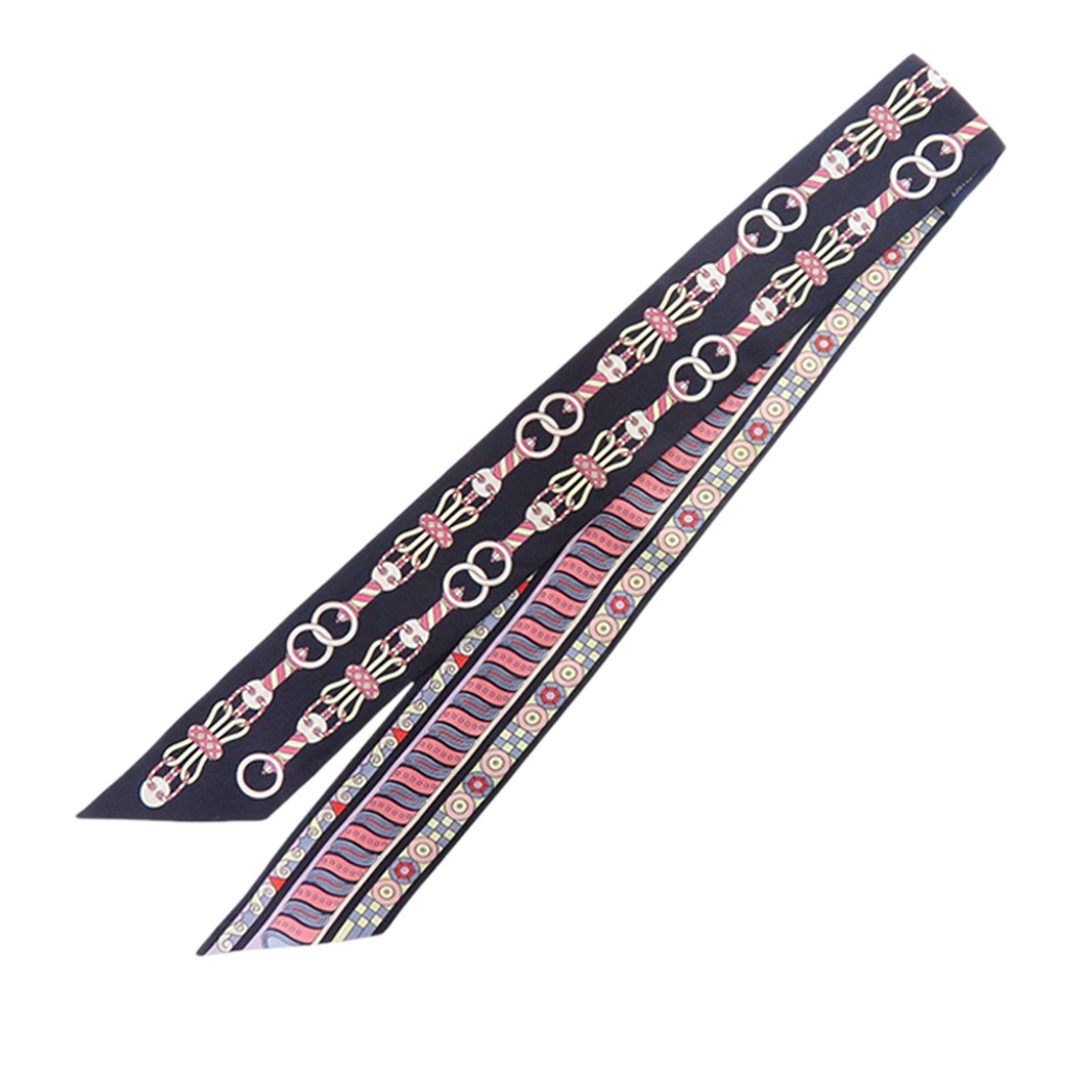 Hermes Blue Silk Twilly Harnais En Rosace: Hermes Blue Silk Twilly Harnais En Rosace This Hermes Harnais En Rosace Twilly scarf is crafted from 100% silk and features an elegant blue print. Made in France, it is designed as a versatile accesso