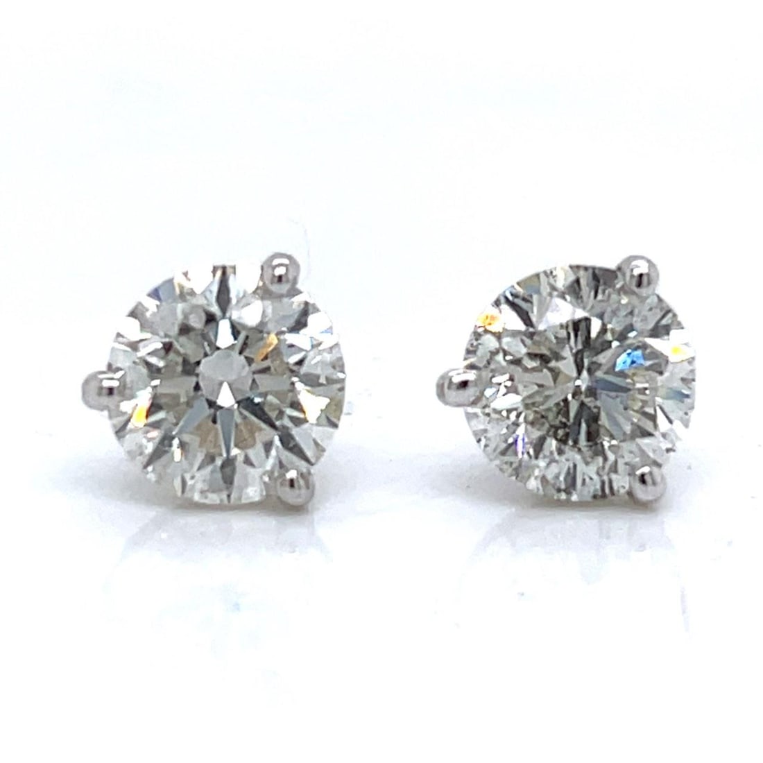 GIA Certified 4.01 Ct Diamond Stud Earrings in 14K White Gold: GIA Certified 4.01 Ct Diamond Stud Earrings in 14K White Gold These stud earrings are crafted in 14K white gold and feature a total diamond weight of 4.01 carats. Each earring is set with a certified 