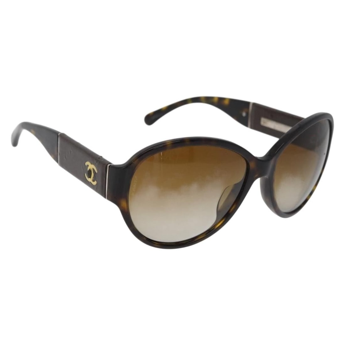 CHANEL Brown Plastic Sunglasses Italy Serial BC9285376: CHANEL Brown Plastic Sunglasses Italy Serial BC9285376 These CHANEL women's sunglasses feature a brown plastic frame and are crafted in Italy. The sunglasses show reasonable wear and tear, including s