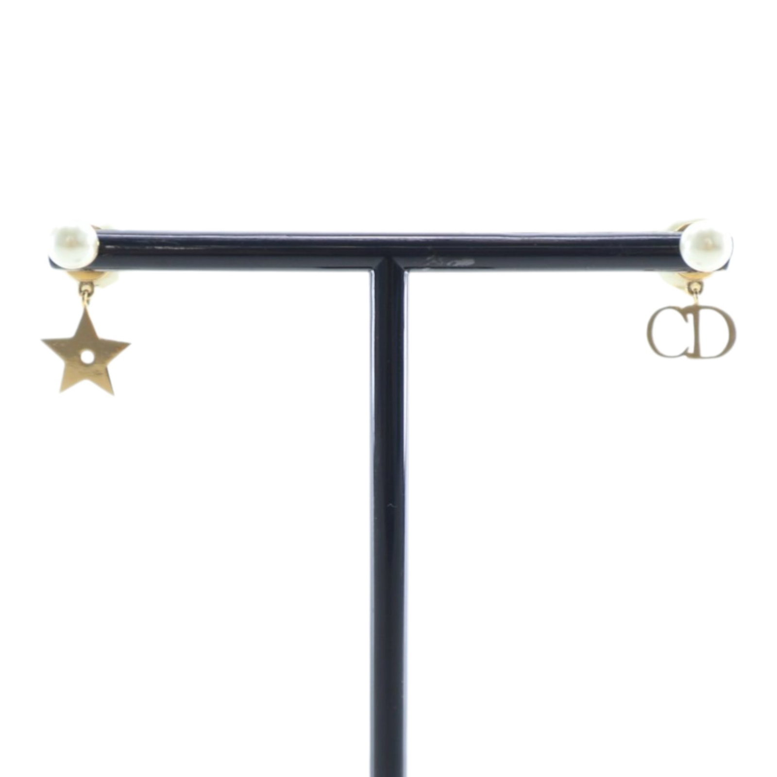Dior Tribales Drop Earrings with Gold Tone Logo and Star Faux Pearl: Dior Tribales Drop Earrings with Gold Tone Logo and Star Faux Pearl These Dior drop earrings feature faux pearl bodies accented with gold-tone hardware, along with logo and star charm details. They ar