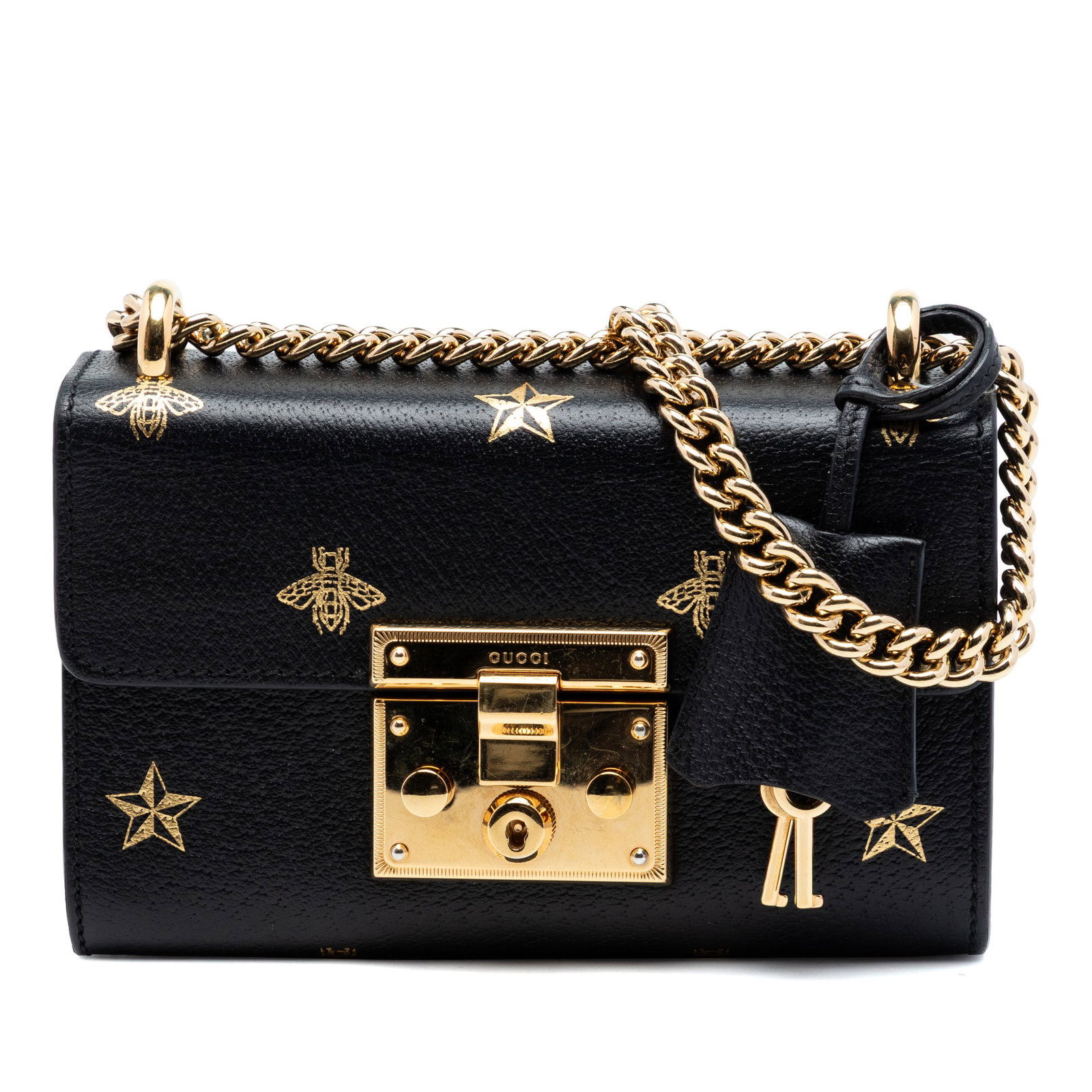 Gucci black leather padlock bee star crossbody bag: Gucci black leather padlock bee star crossbody bag This Gucci Small Calfskin Bee Star Padlock Crossbody bag is crafted from black leather and features a chain strap, a front flap with a push lock clos