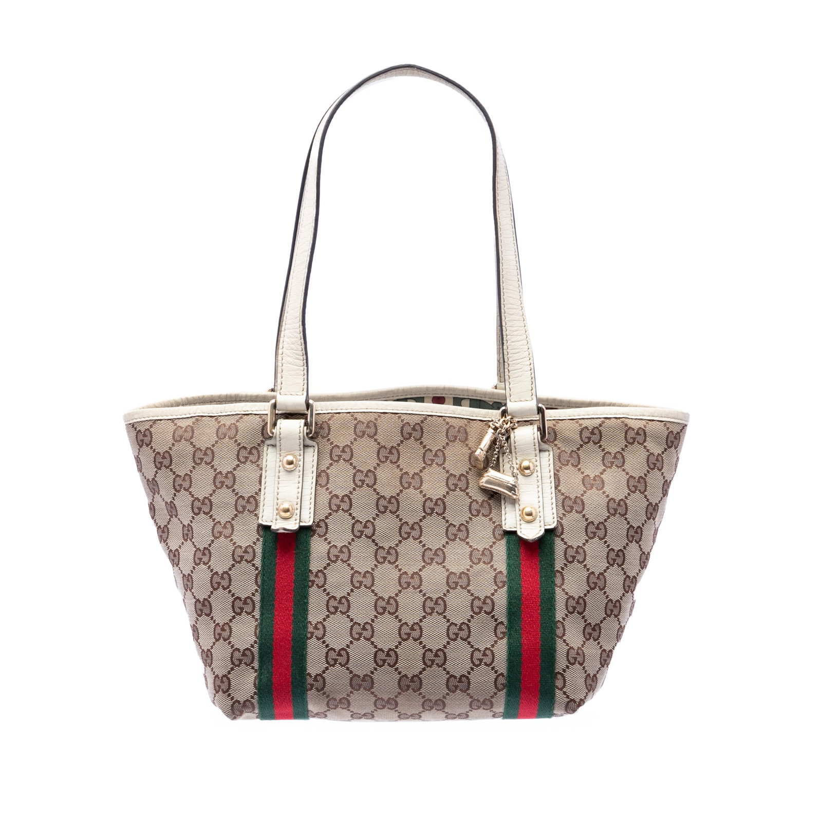 Gucci Jolicoeur GG Canvas Beige Tote Bag: Gucci Jolicoeur GG Canvas Beige Tote Bag This Gucci GG Canvas Jolicoeur Tote features a beige canvas body with flat leather straps, an open top, and an interior zip pocket. The bag is crafted in Italy