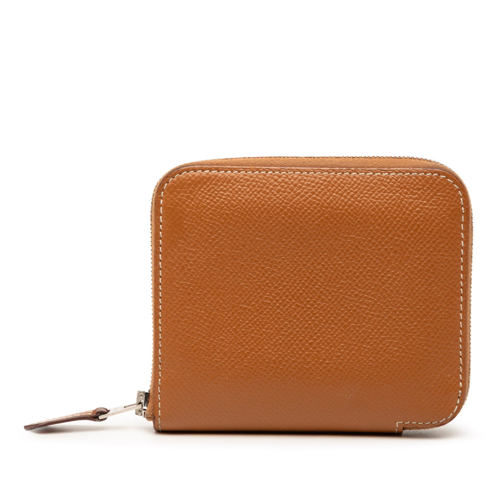Hermes Gold Epsom Leather Silk In Compact Zip Wallet: Hermes Gold Epsom Leather Silk In Compact Zip Wallet This compact wallet is crafted from Epsom leather in a gold-toned brown color and features a zip-around closure. The interior includes both zip and