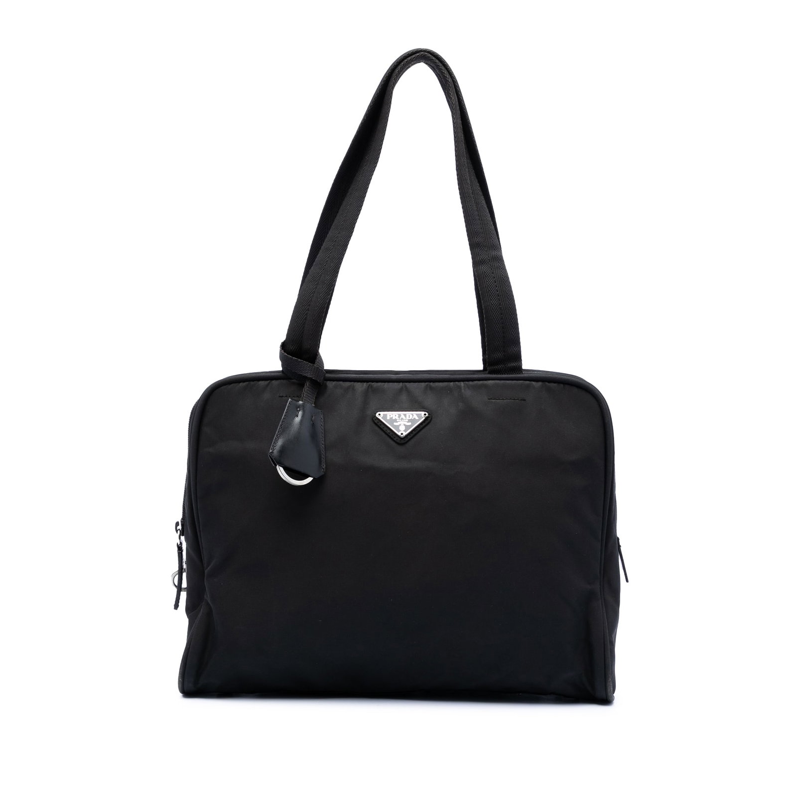 Prada Tessuto Black Nylon Tote Bag with Leather Trim: Prada Tessuto Black Nylon Tote Bag with Leather Trim This Prada Tessuto Tote is crafted from black nylon with leather trim and features flat straps, a top zip closure, and an interior zip pocket. The 