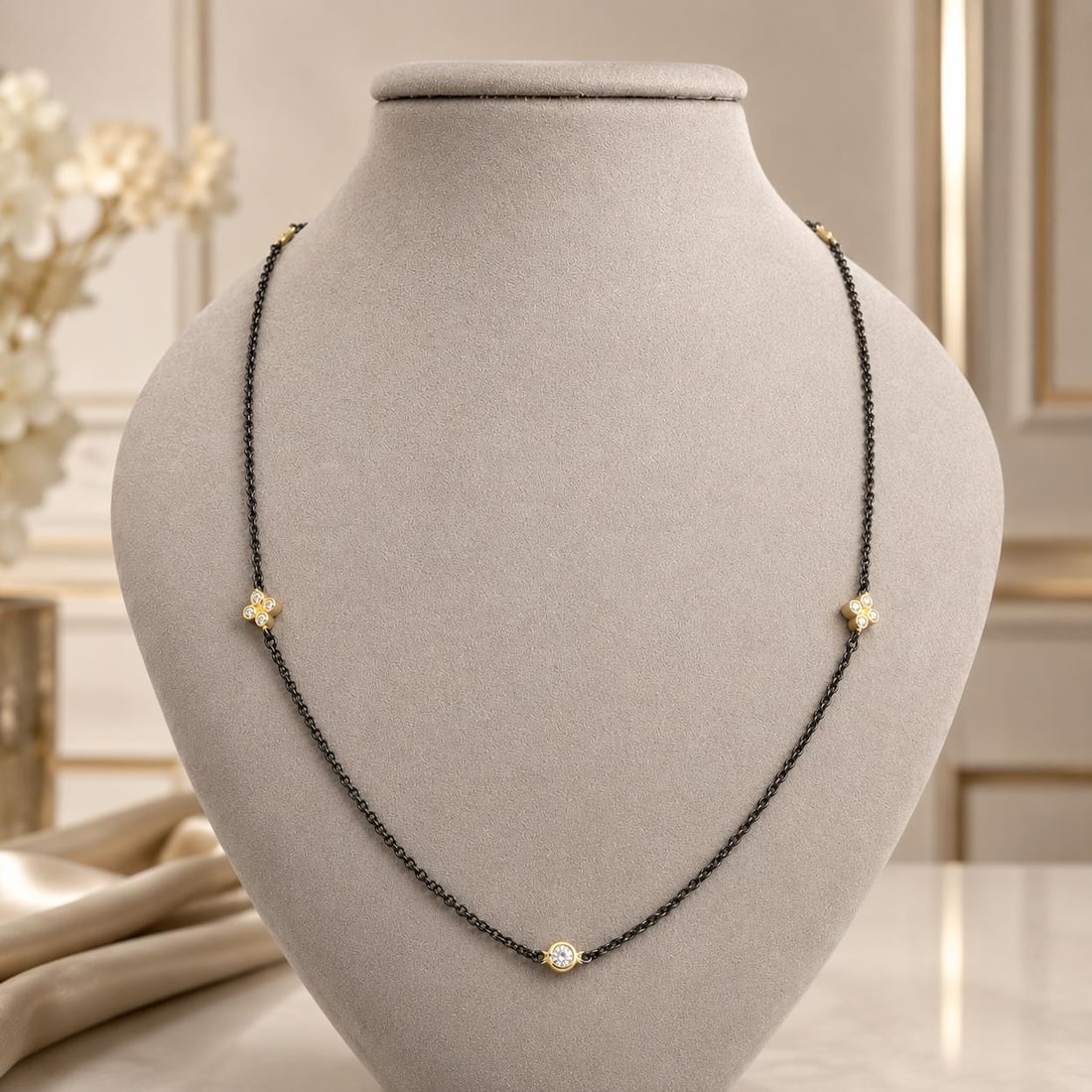 Freida Rothman blackened sterling silver zircon station necklace: Freida Rothman blackened sterling silver zircon station necklace This necklace features a cable link chain crafted from blackened sterling silver and is adorned with 20 round-cut, bezel-set cubic zirc