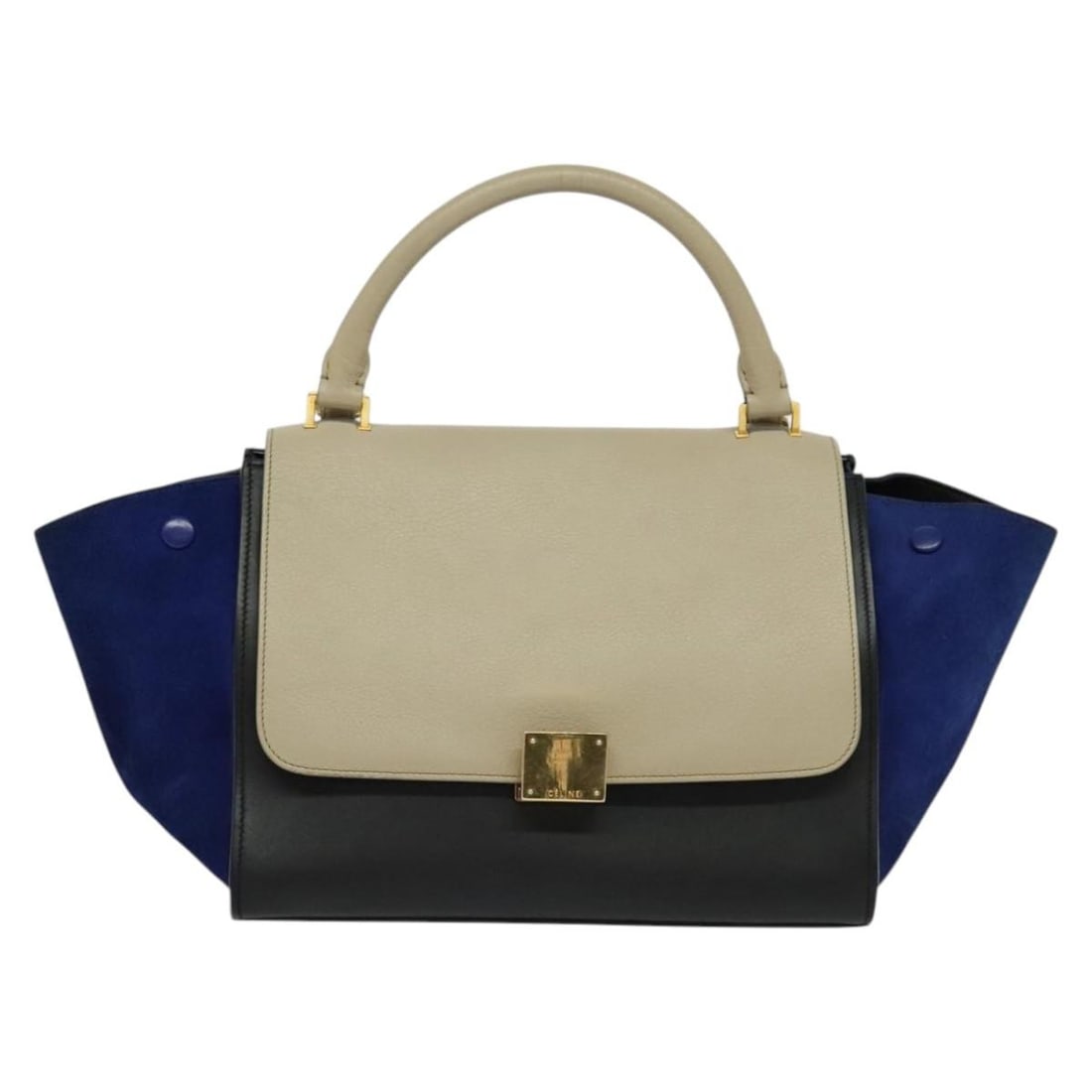 Celine Tricolor Trapeze Leather Handbag in Beige: Celine Tricolor Trapeze Leather Handbag in Beige This Celine Tricolor Trapeze Bag is crafted from beige leather and features a classic, structured silhouette. Designed for women, the bag offers a spac