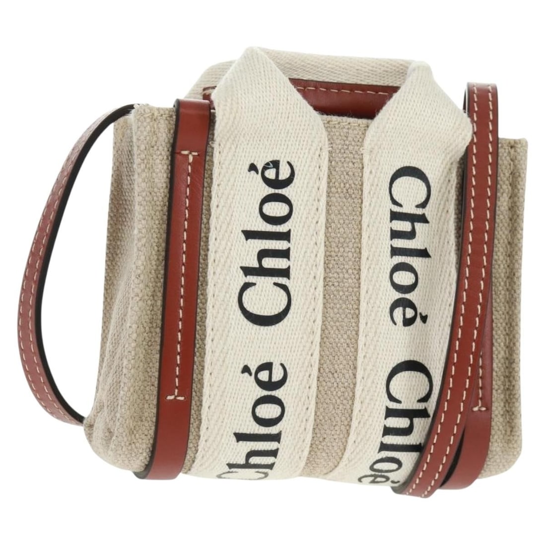 Ivory Canvas Chloe Woody Mini 2way Handbag with Dust Bag: Ivory Canvas Chloe Woody Mini 2way Handbag with Dust Bag This Chloe Woody Mini Hand Bag features a 2-way design crafted from ivory canvas. Made in Italy, it offers a compact size suitable for versatil