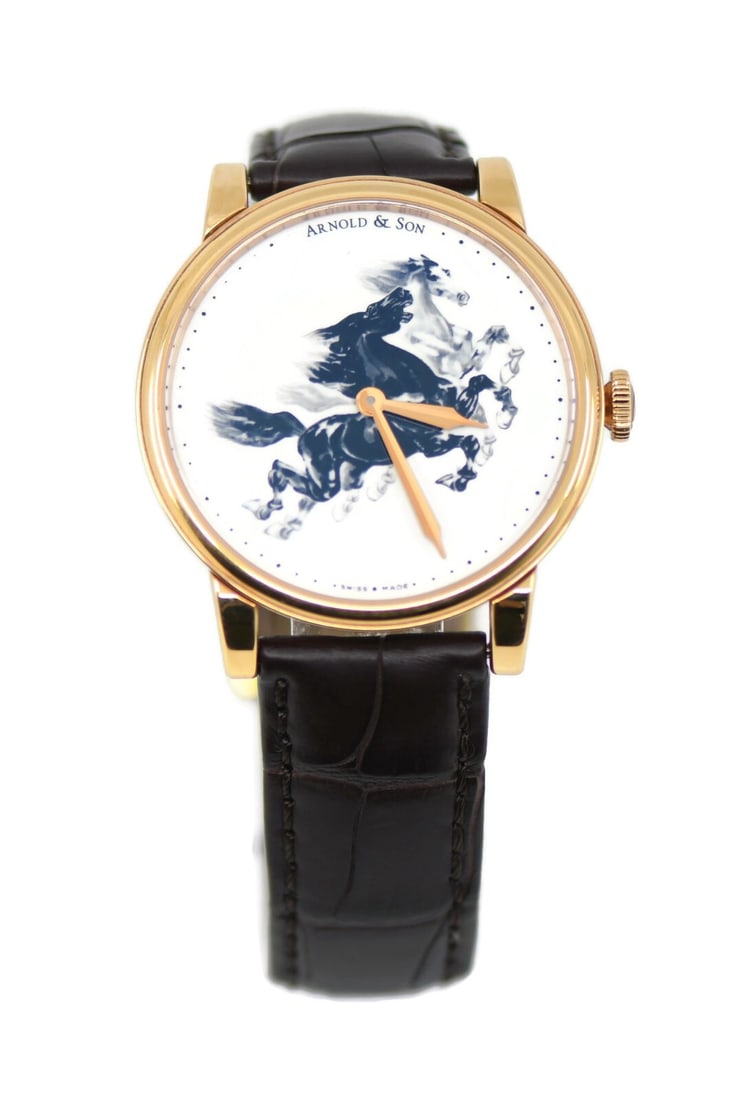 Arnold & Son HMS Horses 18K Rose Gold Watch 1LCAP.W03A.C111A with Box and Papers: Arnold & Son HMS Horses 18K Rose Gold Watch 1LCAP.W03A.C111A with Box and Papers Discover the elegance of the Arnold & Son HMS Horses wristwatch, crafted in luxurious 18K rose gold. This exquisite tim