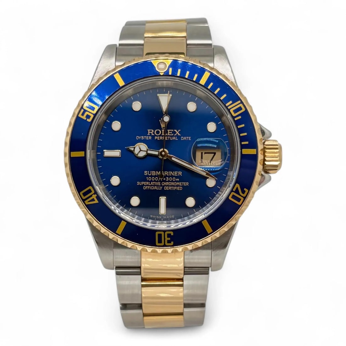 Blue Dial 18K Gold Steel Rolex Submariner Automatic Watch Ref 16613: Blue Dial 18K Gold Steel Rolex Submariner Automatic Watch Ref 16613 This Rolex Submariner wristwatch features a combination of 18K yellow gold and stainless steel with a striking blue sunburst analog 