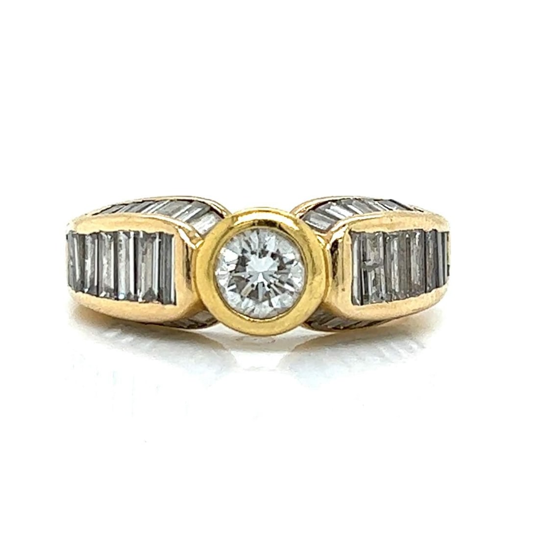 Exquisite 14K Yellow Gold 2.70 Ct Diamond Ring with 42 Baguette Diamonds: Exquisite 14K Yellow Gold 2.70 Ct Diamond Ring with 42 Baguette Diamonds This exquisite 14K Yellow Gold ring showcases a stunning 2.70 Ct. total weight of diamonds. The centerpiece features an approxi