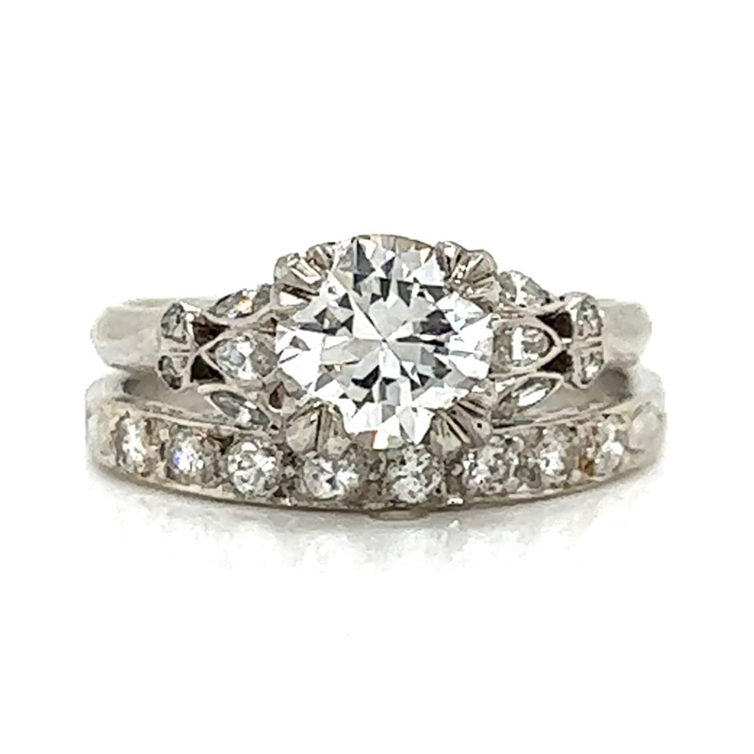 Art Deco 1.27 Ct GIA Certified Diamond Ring with 18 Accents: Art Deco 1.27 Ct GIA Certified Diamond Ring with 18 Accents This stunning Art Deco ring features a GIA Certified diamond weighing 1.27 Ct., showcasing an exquisite H color and VS1 clarity. The diamond