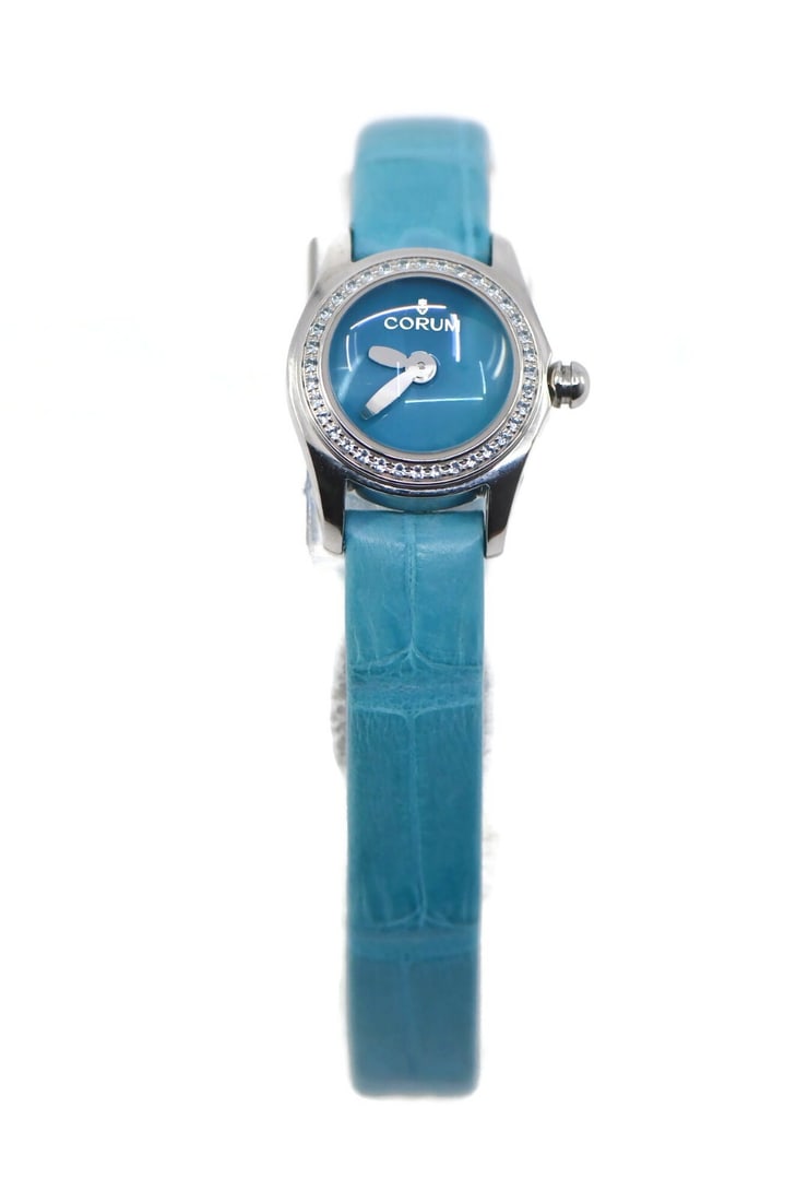 Corum Bubble Mini Diamond Watch L137/03602 Stainless Steel with Box and Papers: Corum Bubble Mini Diamond Watch L137/03602 Stainless Steel with Box and Papers Experience elegance with the Corum Bubble Mini Diamond Stainless Steel Watch. This exquisite wristwatch features a striki