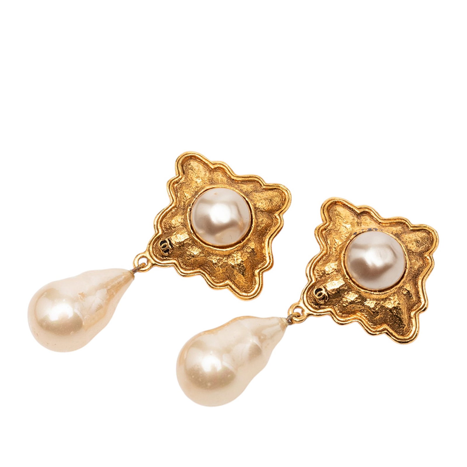 Chanel faux pearl drop clip on earrings gold tone metal: Chanel faux pearl drop clip on earrings gold tone metal These Chanel earrings feature a gold-tone metal design adorned with faux pearl details and secure clip-on closures. Crafted in France, these cos