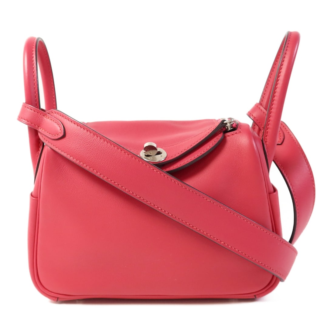 Hermes Mini Lindy Pink Swift Leather Shoulder Bag PHW: Hermes Mini Lindy Pink Swift Leather Shoulder Bag PHW This HERMES Mini Lindy 2-way shoulder bag features a versatile design crafted from luxurious Swift calfskin leather in a striking Rose Extreme pin