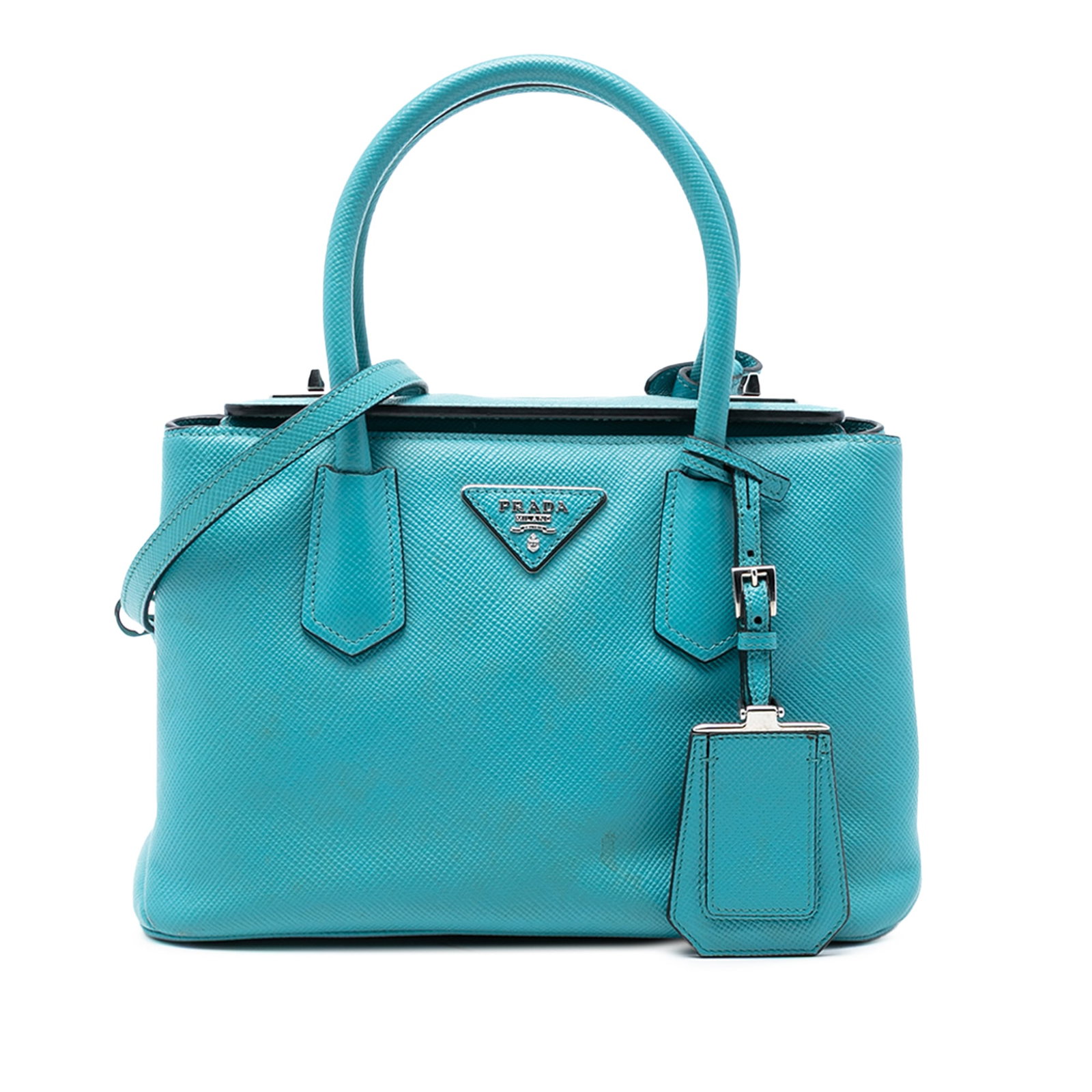 Prada Saffiano Leather Small Blue Satchel with Turnlock Closure: Prada Saffiano Leather Small Blue Satchel with Turnlock Closure This Prada Small Saffiano Cuir Turnlock Twin Satchel is crafted from blue saffiano leather and features rolled leather top handles, a de