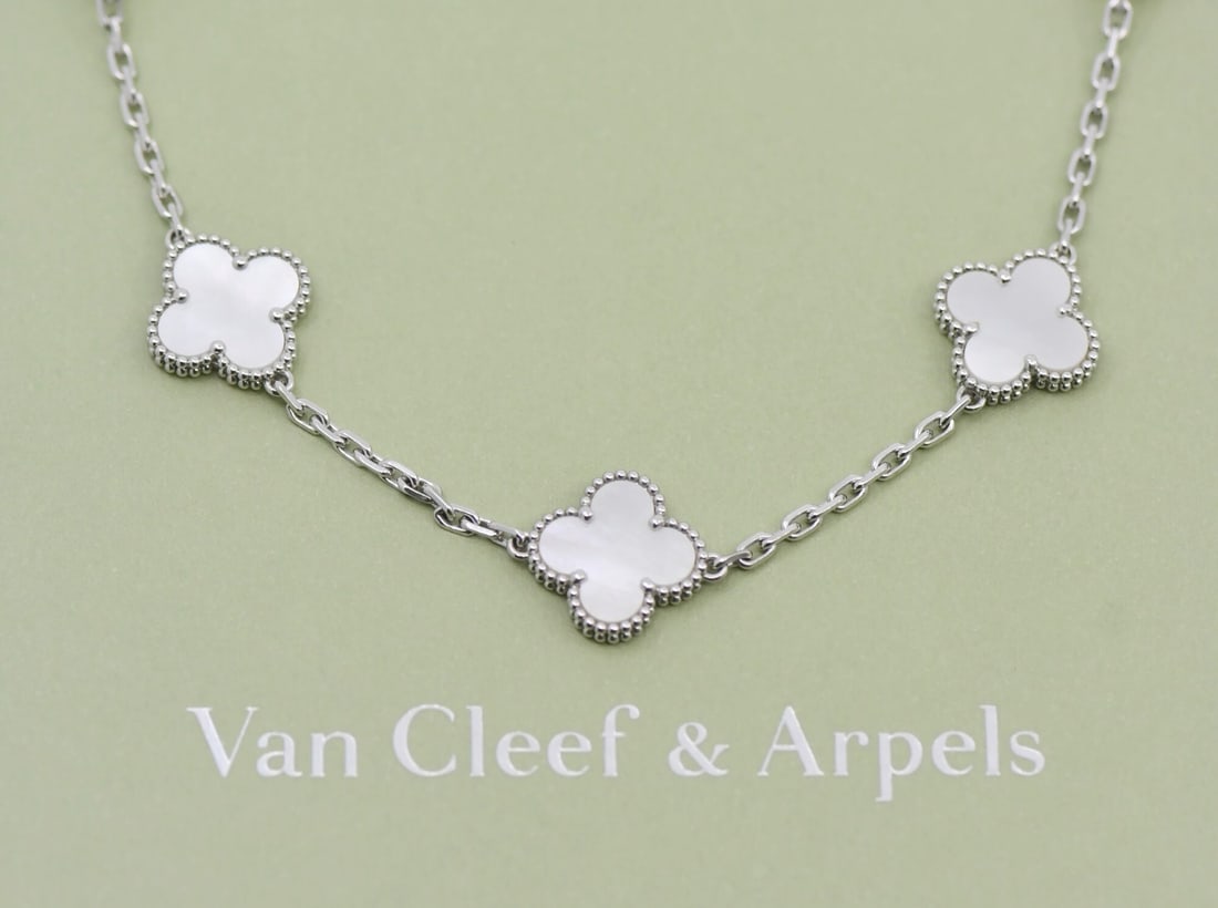 Vintage Alhambra Mother of Pearl 10 Motif Necklace 18K White Gold by Van Cleef & Arpels: Vintage Alhambra Mother of Pearl 10 Motif Necklace 18K White Gold by Van Cleef & Arpels This Van Cleef & Arpels Vintage Alhambra necklace features ten motifs crafted from mother of pearl and abalone, 