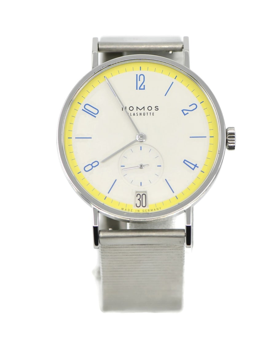 NOMOS Tangente 38MM Stainless Steel Wristwatch Box Papers: NOMOS Tangente 38MM Stainless Steel Wristwatch Box Papers This NOMOS Tangente Lemon Biscuit wristwatch features a stainless steel case and band, offering a sleek and modern design. The watch is powere