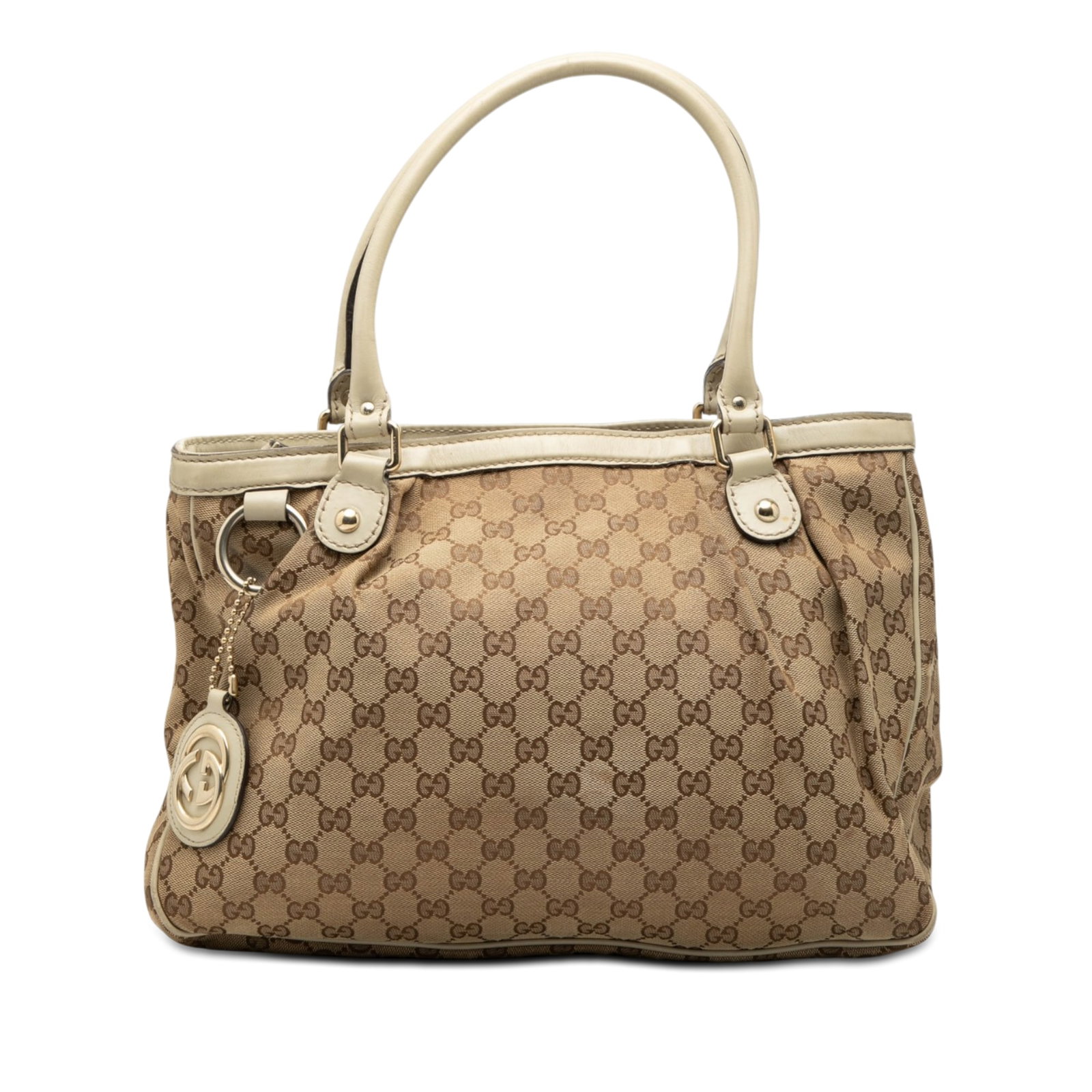 Gucci Sukey GG Canvas Tote Bag: Gucci Sukey GG Canvas Tote Bag This Gucci GG Canvas Sukey Tote features a beige canvas body with leather trim and rolled leather handles. The bag is designed with an open top secured by a magnetic sna