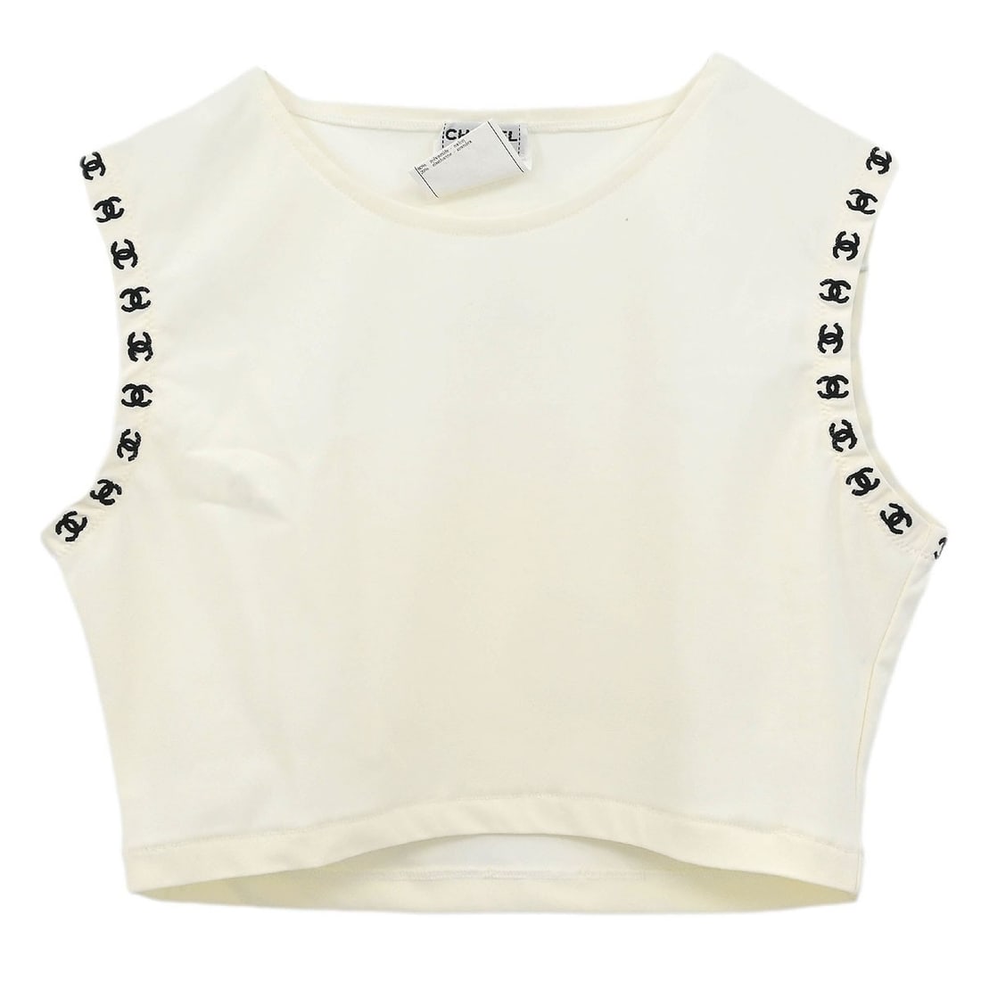 Chanel Vintage White Cropped Sleeveless Tank Top #38: Chanel Vintage White Cropped Sleeveless Tank Top #38 Elevate your summer wardrobe with this vintage Chanel cropped sleeveless top. Featuring a classic round neckline and a basic tank style, this top i