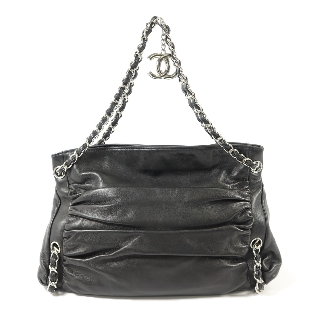 CHANEL Black Lambskin CC Chain Shoulder Bag: CHANEL Black Lambskin CC Chain Shoulder Bag This CHANEL CC shoulder bag is crafted from luxurious black lambskin leather and features silver-tone chain hardware. The bag offers a classic and elegant d