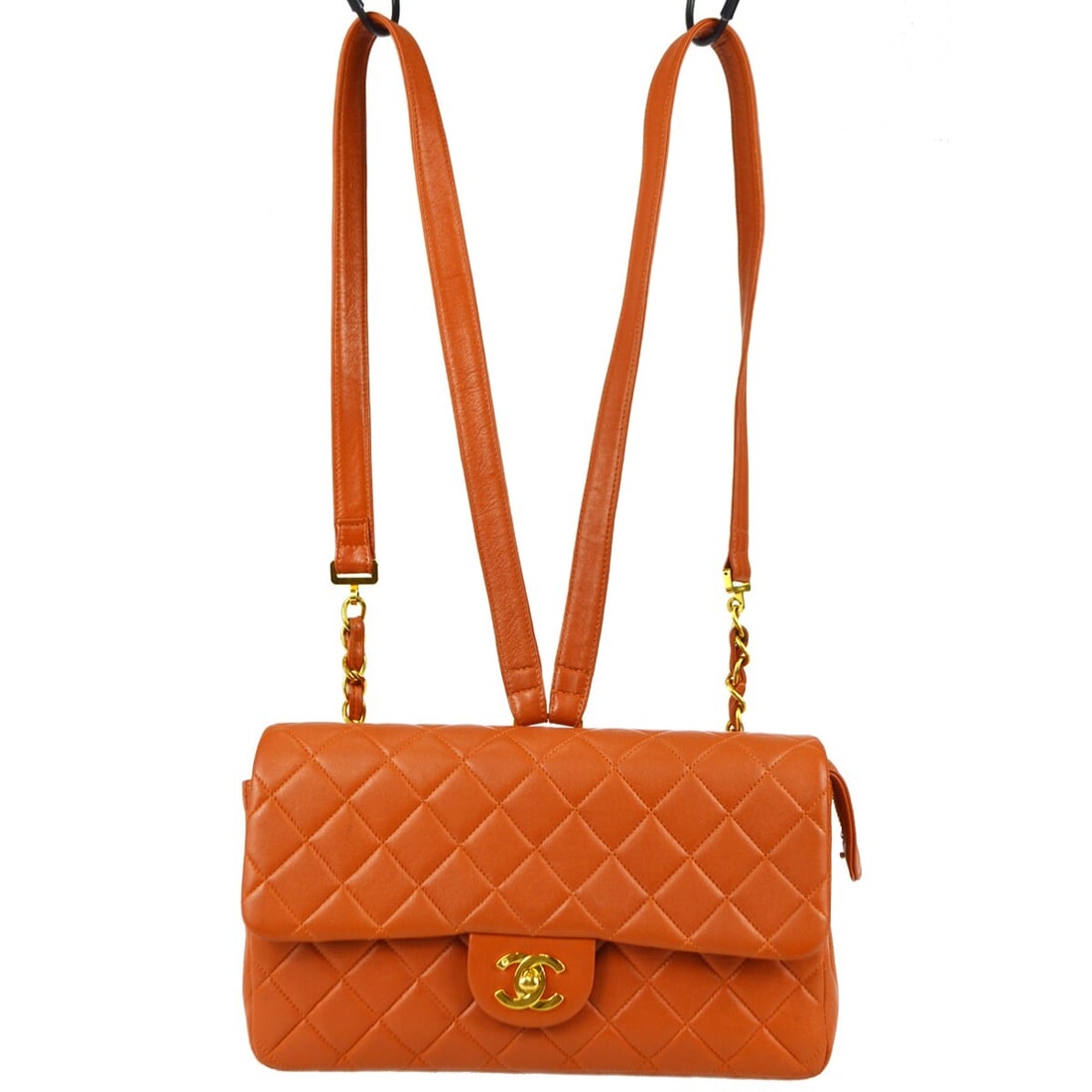 CHANEL Classic Flap orange lambskin backpack: CHANEL Classic Flap orange lambskin backpack This Chanel Classic Flap Chain Backpack is crafted from orange lambskin leather with a signature quilted matelasse pattern. Featuring a medium size, the ba