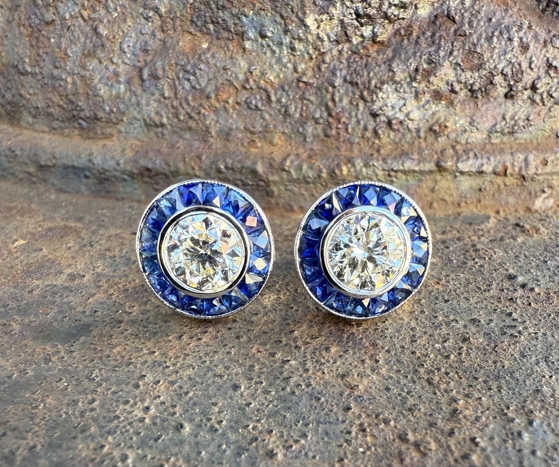 3.60ctw GIA Certified Diamond and Sapphire Halo Stud Earrings in 18k White Gold: 3.60ctw GIA Certified Diamond and Sapphire Halo Stud Earrings in 18k White Gold These un-used stud earrings feature a pair of natural round brilliant cut diamonds with a combined weight of 2.00 carats