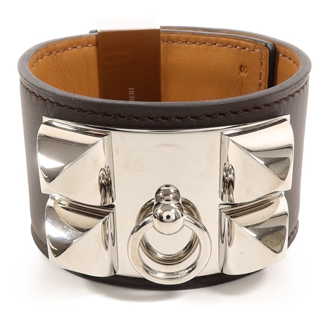 Hermes Collier De Chien Swift Leather Brown Bracelet: Hermes Collier De Chien Swift Leather Brown Bracelet This Hermes Collier De Chien bracelet is crafted from Swift calfskin leather in an Ebene (brown) color. Designed for women, it features a sleek and