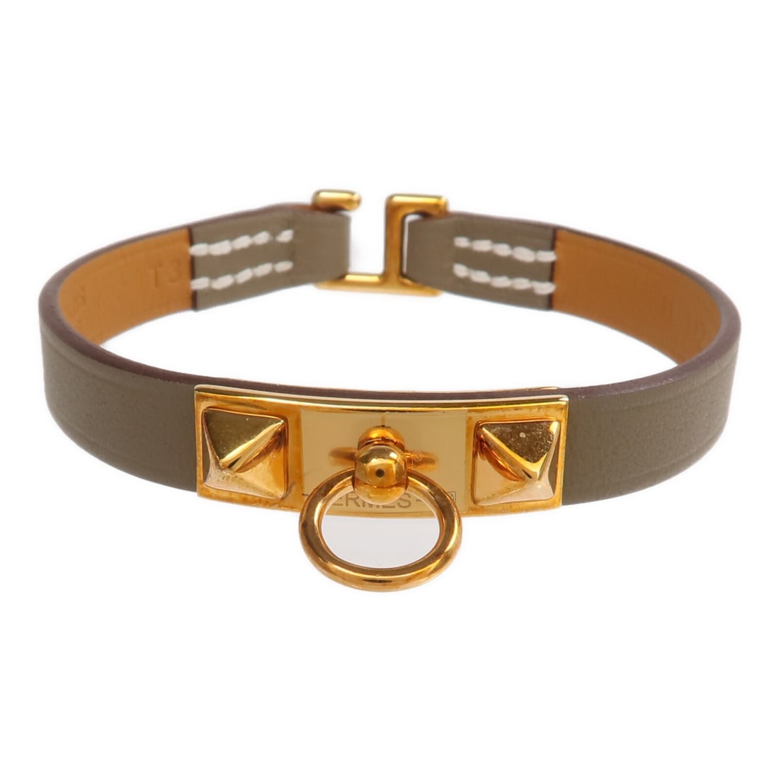 Hermes Rivale Mini Swift Leather Bracelet with Gold Hardware Etoupe Gray: Hermes Rivale Mini Swift Leather Bracelet with Gold Hardware Etoupe Gray This Hermes Rivale Mini Bracelet is crafted from Etoupe gray Swift calfskin leather and features gold-tone hardware. Designed f