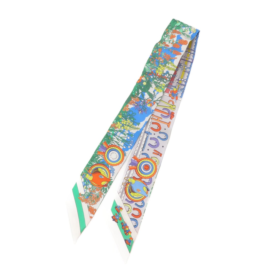 Hermes Twilly silk multicolor scarf: Hermes Twilly silk multicolor scarf This Hermes Twilly scarf features a vibrant multicolor design in green, blue, and orange tones. Expertly crafted from luxurious silk, it is designed for women and o