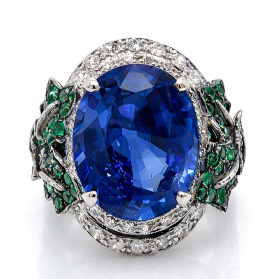 Platinum Ring Featuring 10.50 Ct GIA Ceylon Sapphire Diamonds and Emeralds: Platinum Ring Featuring 10.50 Ct GIA Ceylon Sapphire Diamonds and Emeralds This platinum ring features a GIA certified Ceylon sapphire weighing approximately 10.50 carats, accompanied by around 100 di