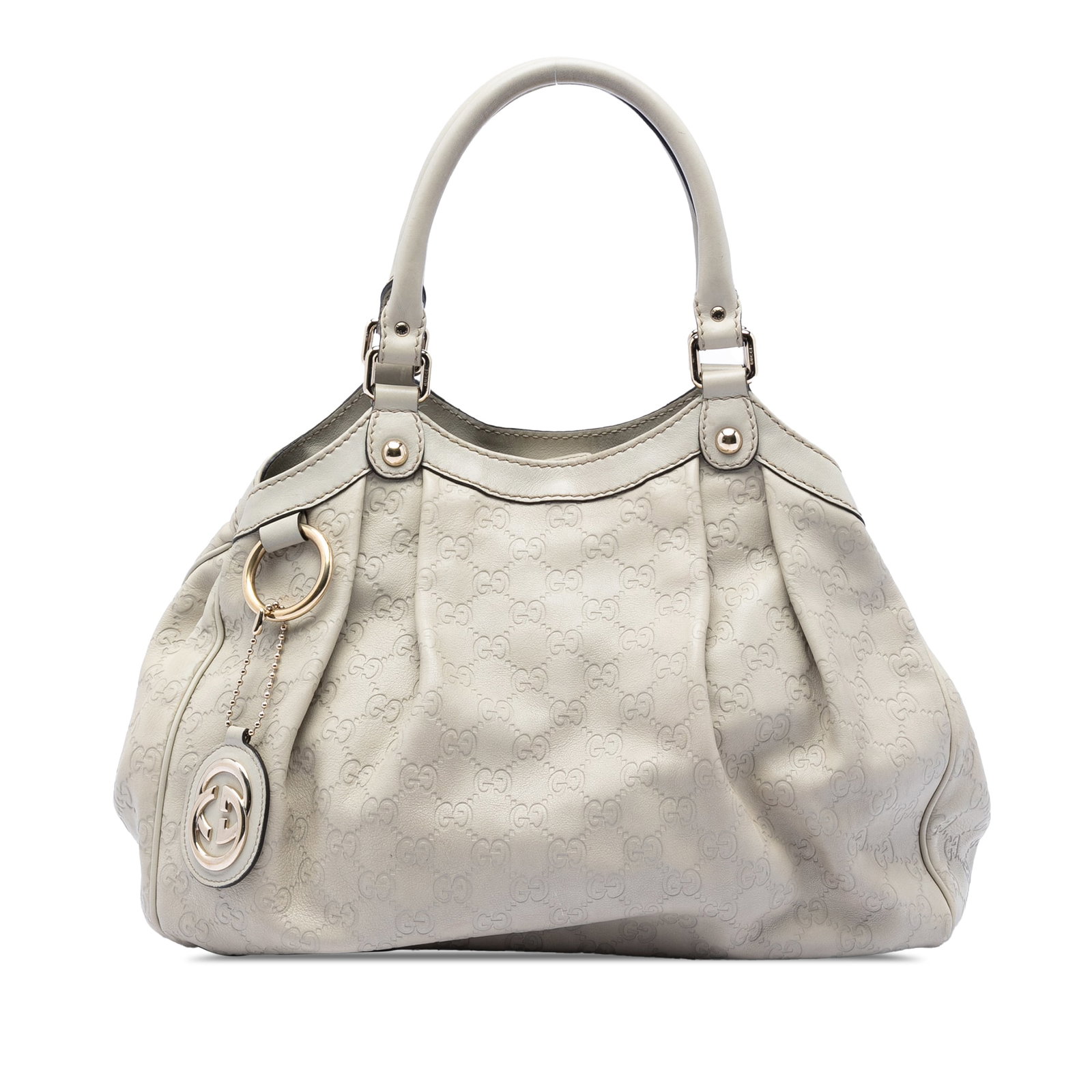 Gucci White Guccissima Sukey Leather Tote Medium: Gucci White Guccissima Sukey Leather Tote Medium This Gucci Medium Guccissima Sukey Tote features an embossed leather body in white, rolled leather handles, an open top with a magnetic snap closure, a
