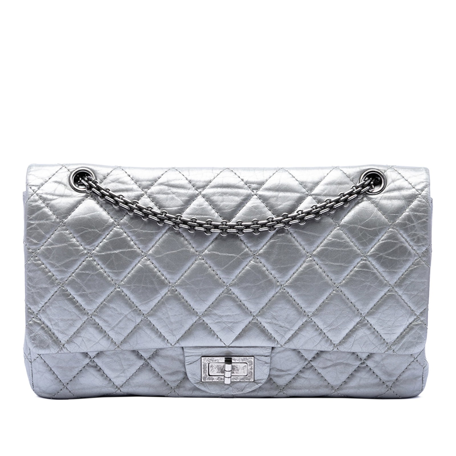 Chanel Reissue 2.55 227 Metallic Silver Quilted Shoulder Bag: Chanel Reissue 2.55 227 Metallic Silver Quilted Shoulder Bag This Chanel Quilted Metallic Aged Calfskin Reissue 2.55 Double Flap 227 shoulder bag features a silver-tone aged calfskin leather exterior 