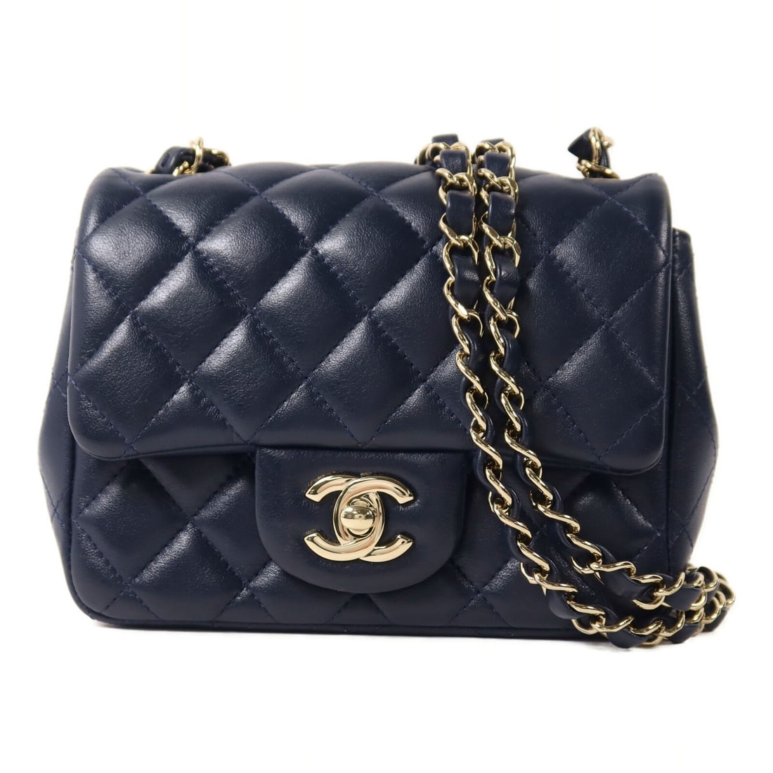 CHANEL Mini Classic CC Lambskin Shoulder Bag Navy GHW 17: CHANEL Mini Classic CC Lambskin Shoulder Bag Navy GHW 17 This CHANEL Mini Classic 17 chain shoulder bag features a luxurious navy lambskin leather exterior with the iconic CC detail and gold-tone hard